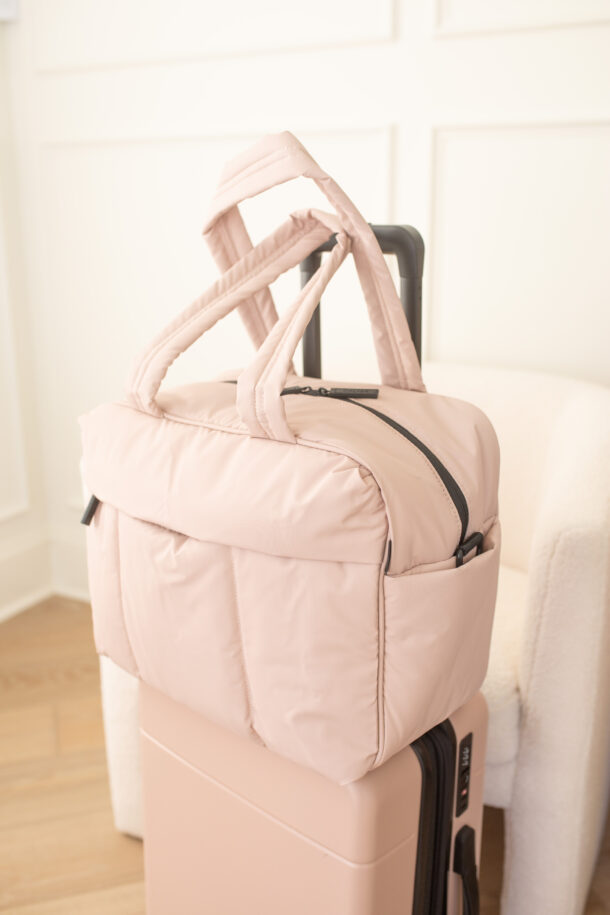 pink travel bag, pink carry-on bag, calpak pink luggage