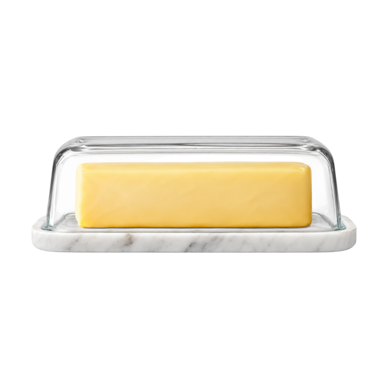 Glass-domed butter dish with a marble base holding a stick of butter.